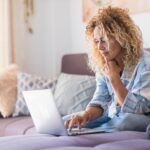 Smiling,Caucasian,Adult,Hipster,Sit,Relax,On,Couch,Using,Modern 